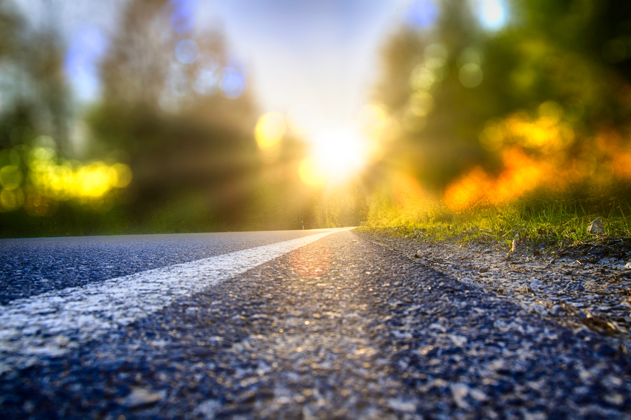 Street in backlight with bokeh, lensflares and sunbeams