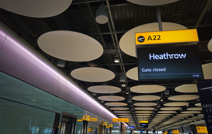 Heathrow airport terminal showing modern gate information display