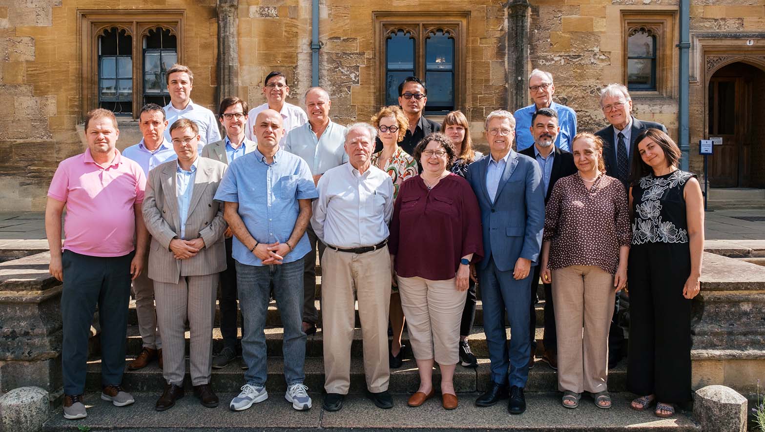 Delegates of the Oxford Workshop #1 gather for a group photo on the steps of the quad at Christ Church in Oxford.